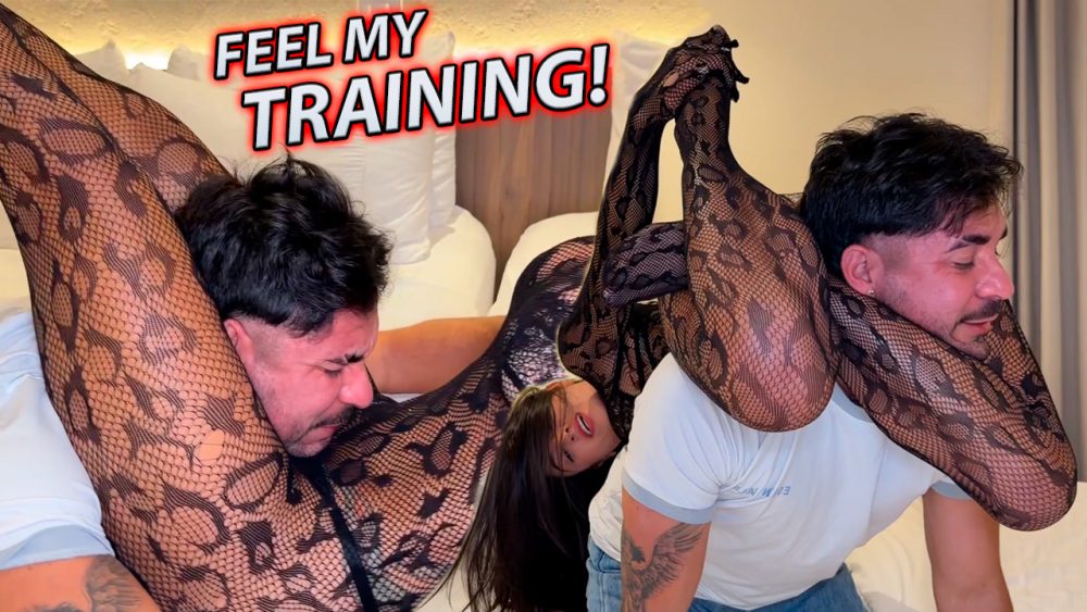 Woman in snake skin outfit wraps her entire body around her boyfriend and squeezes him into submission