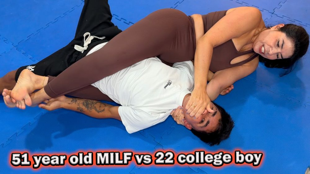 mature woman in yoga pants wrestles a college boy