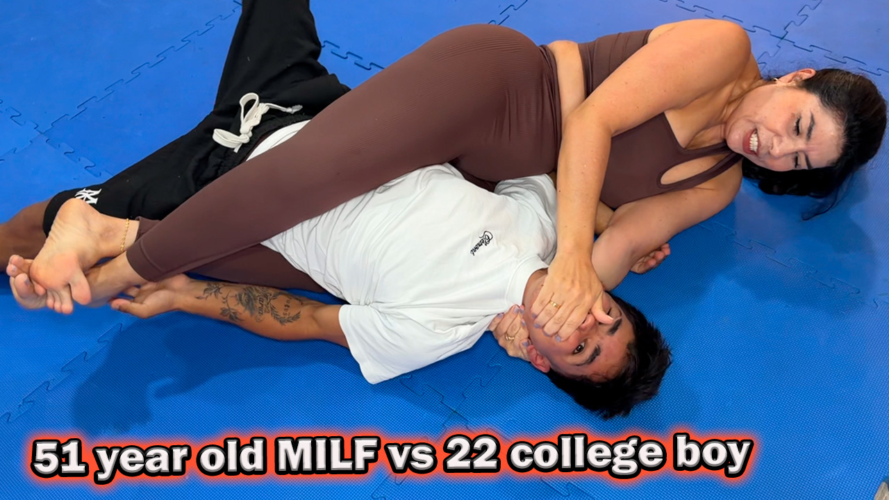 mature woman in yoga pants wrestles a college boy